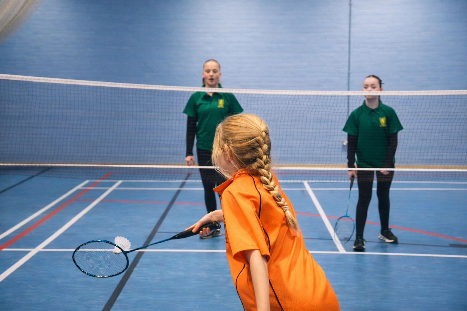 Students engaged in a sports activity in the sports hall